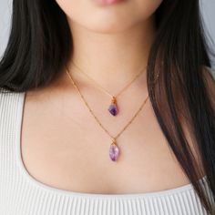 "This lovely purple raw amethyst double layered necklace set looks lovely stacked, or as a single necklace when you need to tone it down a notch.    -Two Necklace Set -Handmade with Genuine Amethyst Crystals -16\" Cable Chain and 18\" Beaded Chain -Each Pendant is One-of-a-Kind -Pure 14k Gold Fill Chain.   - More Info - Our chains are made with either pure sterling silver or 14k gold fill, depending on the color you choose. Unlike other electroforming artists, I use sterling silver instead of co Purple Double Strand Jewelry For Gifts, Dainty Amethyst Necklaces With Natural Stones, Gold Amethyst Gemstone Crystal Necklace, Purple Raw Stone Necklace For Gift, Gold Amethyst Crystal Necklace With Faceted Beads, Paper Clip Necklace, Single Necklace, Amethyst Raw Stone Pendant Necklace, Elegant 14k Gold-filled Crystal Necklace Gift