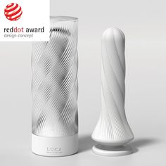 a white vase sitting next to a red dot award logo