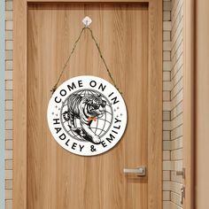 a wooden door with a sign that says come on in harley & any