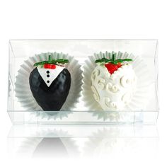 two chocolate covered strawberries in the shape of heart and groom's suit on display