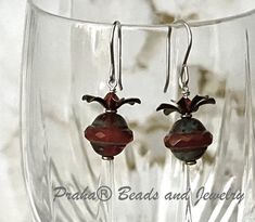 Funky Czech glass Saturn beads with a red opaline Picasso finish are perfect for dark winter days. Made with Czech pressed glass beads. Beads measure 8MM by 10MM. Saturn Earrings, Metal Flowers, Winter Days, Pressed Glass, Rust Color