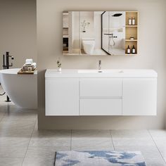 a bathroom with a sink, mirror and bathtub in it's center area