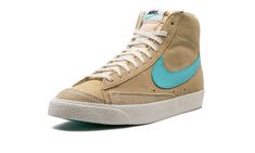 The Nike Blazer Mid ‘77 “Tan/Aqua” is a casual colorway of the vintage basketball shoe with appealing aqua-colored accents.  The Blazer Mid ‘77 receives a fresh makeover for the warm weather months on the “Tan/Aqua” style.  The shoe’s upper is designed in tan suede with tonal overlays on the toe and forefoot.  An Aqua leather Swoosh appears on both sides.  Classic “Nike” branding in black lettering is found on the heel and black “Nike” and Aqua Swoosh detailing dot the tongue tag.  A white vulcanized rubber sole completes the look.  Release date: April 27, 2023 Retro Nike High-top Sneakers With Gum Sole, Nike Vintage High-top Sneakers With Gum Sole, Sick Shoes, Nike Branding, Vintage Basketball, Nike Blazer Mid 77, Nike Blazer Mid, Nike Blazers Mid, Aqua Shoes