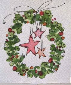 a christmas wreath with three stars hanging from it