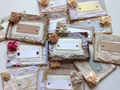 there are many different frames with flowers on them and some tags attached to the edges