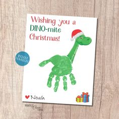 a handprinted christmas card with the words wishing you a dino - mite christmas