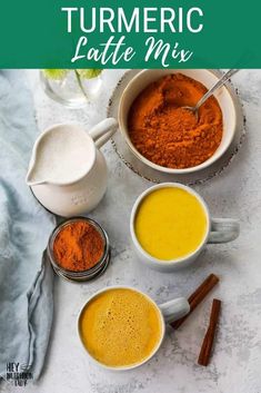 turmeric latte mix in white mugs with cinnamon sticks and spices on the side