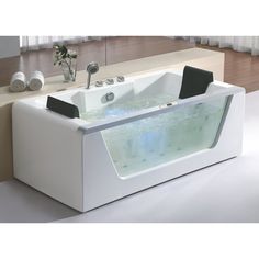 a white bath tub sitting on top of a counter