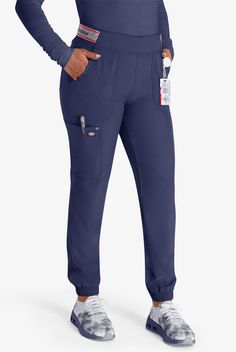 A true game-changer in healthcare apparel, the Women s Mid Rise Jogger Scrub Pant from Dickies redefines what it means to be comfortable, practical and stylish. This moisture-wicking pair from the EDS NXT collection offers a cool, cozy fit with elastic cuffs and an adjustable waistband, while heritage styling and perfectly-placed pockets add flair and function to this wardrobe staple. • Contemporary fit • Mid Rise • Drawstring elastic • Tapered leg • Athletic styling • Total of 5 pockets • 2 fro Uniform Advantage, Medical Uniforms, Cargo Joggers, Heritage Fashion, Adjustable Waistband, Cozy Fits, Scrub Pants, Petite Size, Game Changer