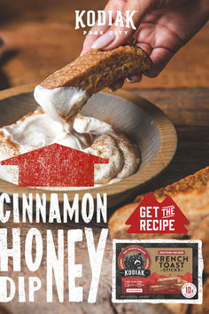 an advertisement for kodak's cinnamon honey dip with a person dipping something in it