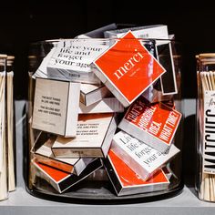 several matches are stacked in a glass container