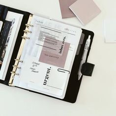 an open planner book sitting on top of a desk