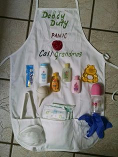 a white apron with baby items on it