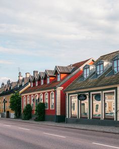 a row of houses on the side of a road