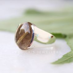 Natural Golden rutile ring, Real Sterling Silver ring, cocktail ring, alternative engagement ring, avant garde, birthstone ring, golden Rutile jewellery Description: The gemstone is a OVAL shaped GOLDEN RUTILE. GEMSTONE SIZE-18*13 mm. You have an option to choose a gem for yourself from a set of the stones. Please ask. The rest of the ring is made from 925 STERLING SILVER i.e 92.5% pure silver. And it DOESN'T HAVE ANY LEAD OR NICKEL. I make more than 50 DIFFERENT GEMSTONES. If you want other gem Fine Jewelry Promise Ring With Natural Inclusions, Elegant Anniversary Rings With Natural Inclusions, Black Onyx Jewelry, Different Gemstones, Alternative Engagement Ring, Onyx Jewelry, Statement Ring Silver, Black Onyx Ring, Alternative Engagement Rings