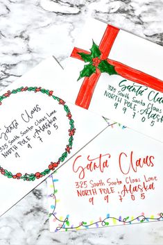 two envelopes with christmas designs on them