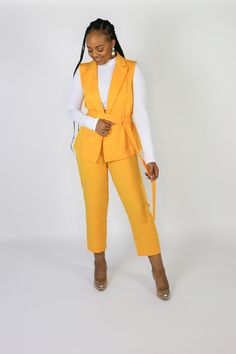 STYLE NOTES: Turn heads in this gold, two-piece pants set. The pants are cropped and the jacket has a lapel-neckline and is belted at the waist for the perfect feminine silhouette. Polyester Lapel collar High-rise, cropped pants Side zip closure Detachable belt Dry clean only FIT NOTES: Model is 5'6 and wearing size medium. Fits true to size with no stretch. Chic Belted Sets For Spring, Chic Belted Spring Sets, Belted Sets For Spring Workwear, Spring Workwear Sets With Belted Details, Spring Workwear Belted Sets, Gold Chic Sets For Spring, Chic Gold Sets For Spring, Two Piece Pants Set, Feminine Silhouette