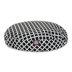 a black and white round dog bed with a red circle on the bottom, in front of a white background