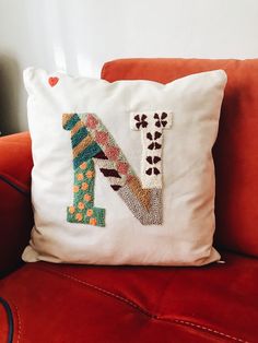 a pillow that has the letter n on it