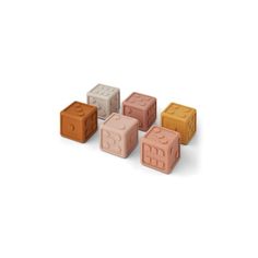 four different colored blocks sitting next to each other