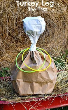 a turkey leg ring toss game is shown in front of hay bales with the words turkey leg rings on it