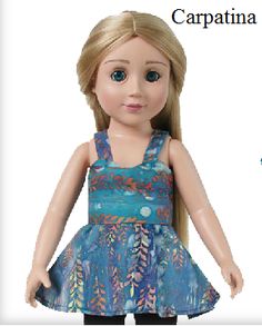 the doll is wearing a blue dress and black pants