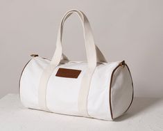 White Canvas Duffle Bag

Introducing our versatile White Canvas Duffle Bag, your ideal companion for travel, exploration, and wellness on the go. Crafted from natural cotton canvas with genuine leather accents and elegant gold zip and accessories, this bag exudes sophistication.

Its spacious design, measuring 9.4" x 9.4" x 15.5" (W x H x L), ensures you can carry all your wellness essentials with ease. Duffle Bag Aesthetic, Wellness Essentials, Canvas Duffle Bag, Travel Duffle Bag, Utility Bag, Wellness Journey, Travel Duffle, Duffle Bag Travel, Bags Aesthetic