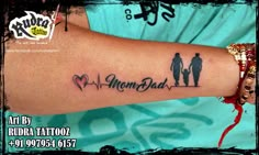 a person with a tattoo on their arm that says, mom and dad at the bottom