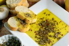 garlic bread is on a plate next to other ingredients