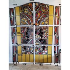 four stained glass panels with different designs and sizes, all showing the same size as each other