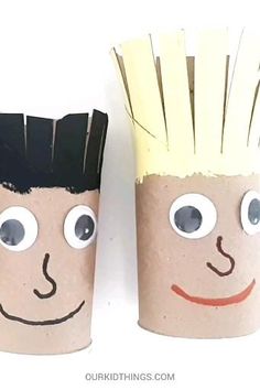 two toilet paper cups with faces painted on them, one has hair and the other has eyes