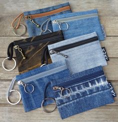 six pairs of denim zippered pouches with keychains