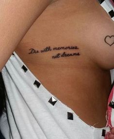 a woman's chest with the words, do with memories not dreams written on it