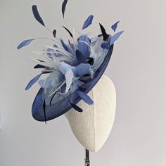 THIS ONE IS MADE TO ORDER IN YOUR CHOICE OF COLORS ☀ Follow this link for more beautiful choices from 'Indigo Hats'  https://www.etsy.com/shop/IndigoHats ☀ SCARLET - Special Occasion Hat with blue feathers. Showstopping feathers in various shades of blue adorn this unusual hat.   I made the base in a mid blue sinamay straw and added navy  crinoline around the edge  for a contemporary touch. A perfect piece to bring a couple of colors together to match your outfit! Main disc measures 12" x 13" Please contact me if you have any questions, I am always here to help:) Jaine ☀ Find your perfect fascinator here from 'Indigo Hats' https://www.etsy.com/shop/IndigoHats ☀ Thank you for considering one of my headpieces for your special occasion!     Each one is meticulously handmade - and I loved maki Formal Blue Fascinator With Handmade Flowers, Elegant Blue Mini Hat With Structured Crown, Elegant Blue Short Brim Headpiece, Elegant Blue Headpiece With Handmade Flowers, Elegant Blue Headpiece With Short Brim, Blue Fascinator For Royal Ascot Garden Party, Royal Ascot Formal Fascinator With Handmade Flowers, Blue Fascinator For Garden Party At Royal Ascot, Blue Fascinator For Garden Party And Royal Ascot