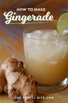 a glass with gingerade in it next to a sliced ginger and a lime on the side