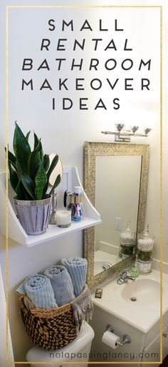 a white toilet sitting next to a bathroom sink under a mirror and a potted plant