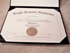 a diploma certificate is laying on the floor