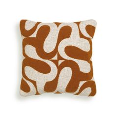 an orange and white pillow on a white background