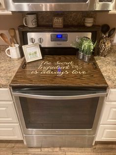 a microwave oven sitting on top of a kitchen counter next to a potted plant