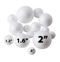 white plastic balls are arranged in the shape of numbers, and measurements for each ball