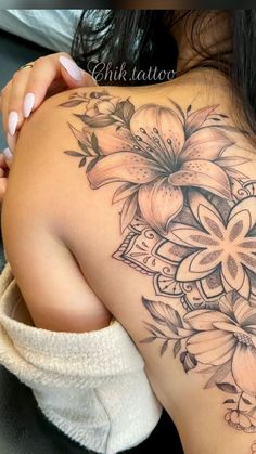 a woman with a tattoo on her back