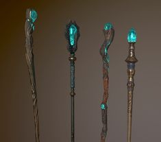 four different types of canes with green lights on them, all in various shapes and sizes