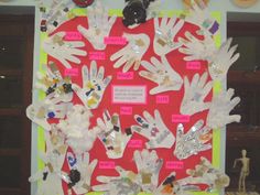 a bulletin board with lots of handprints on it