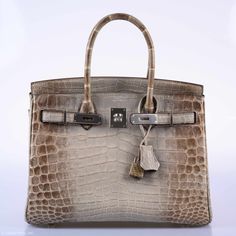 The Himalayan Birkin, named for its evocation of the famous snow-capped mountain range that crowns the world, itself crowns the range of Birkin bags in Hermes' oeuvre. Within this crown, there are a few jewels even more precious than the rest. The Gris Cendre Himalayans are particularly special examples that are produced on a level of magnitude less than the already extremely rare White Himalayans. These bags ombre from light to dark gray and typically have much more even and smooth coloring tha Himalayan Birkin, Investment Bags, Snow Caps, Hermes Birkin 30, Vanuatu, Mountain Range, Sierra Leone