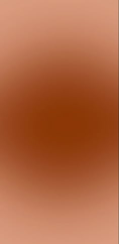 a blurry image of an orange and brown background