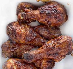 some meat is sitting in a white bowl on the table and ready to be eaten