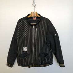 Beautiful Com8 vintage jacket. A real french hip hop brand from the 90s, created by the famous french rapper Joey Starr! Black with mate gold stripes. Bomber shaped. Black and mate gold rib knit cuffs and bottom band. Perfect for an old school hip hop style! Material is 85% cotton / 15% polyester Condition is : very good vintage condition MADE IN FRANCE Size is XL (refer to measurements) Do not hesitate to DM if you have any questions ! shoulder seam to shoulder seam : 59cm / 23,25in Armpit to a Retro Track Jacket With Ribbed Cuffs For Streetwear, Retro Streetwear Track Jacket With Ribbed Cuffs, Winter Hip Hop Track Jacket For Streetwear, Vintage Winter Track Jacket For Streetwear, 90s Winter Streetwear Track Jacket, Black Hip Hop Varsity Jacket, Black Cotton Hip Hop Varsity Jacket, Hip Hop Cotton Outerwear With Graphic Print, Black Cotton Hip Hop Sweatshirt