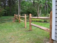 a wooden fence in front of a house