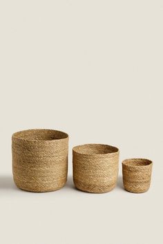 three woven baskets sitting next to each other