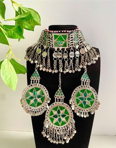 Full Green Afghan jewellery set, Afghan Jewellery Vintage Kuchi Choker Necklace, Afghan Jewellery, Afghan Fashion  Set includes:  -oversized tikka -chocker necklace  -oversized earrings  Message for any enquiries Our Aim as a business is to connect Afghan women with their roots and to make anyone that purchases our jewellery feel powerful and beautiful as each and everyone of our items is handcrafted with care and love. Traditional Green Metal Jewelry Sets, Green Metal Jewelry For Festivals, Green Festival Jewelry, Bohemian Green Jewelry Sets For Party, Vintage Green Necklace For Festivals, Handmade Green Jewelry Sets For Festivals, Green Afghan, Afghan Jewellery, Afghan Women